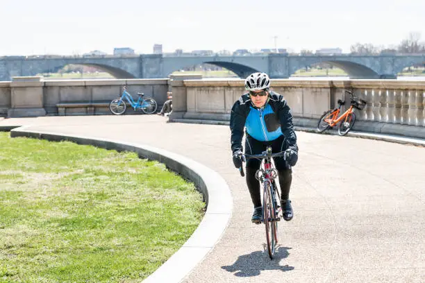 person Biking Along the Potomac River Trails