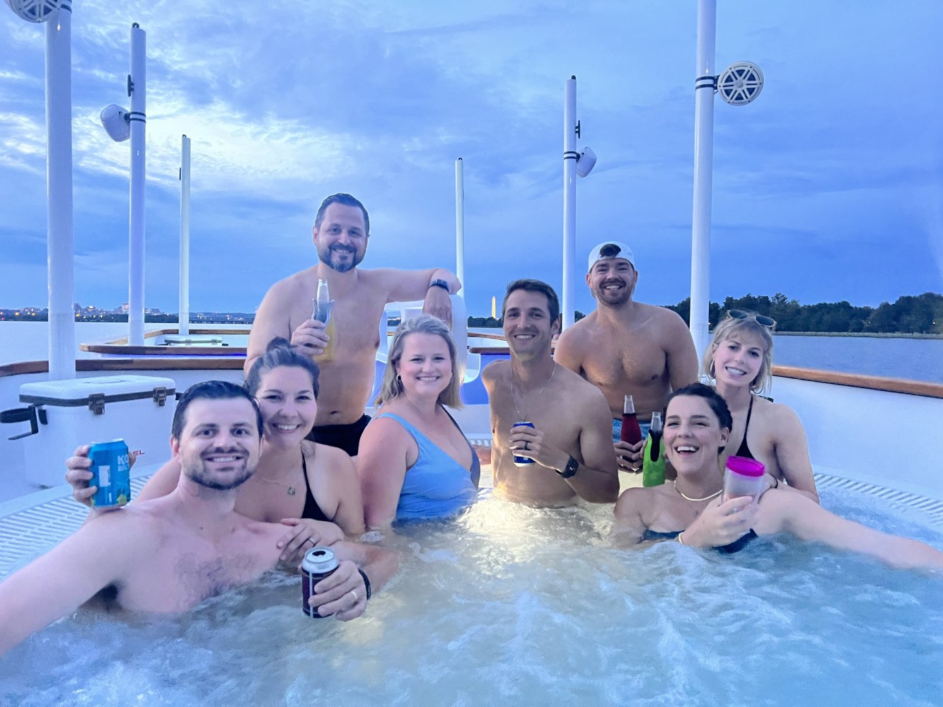 people smiling while soaking in a hot tub boat in Washington DC