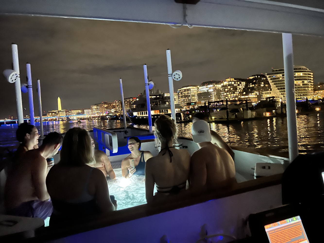 Night time engagement party on hot tub boat in DC