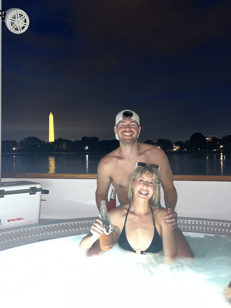 man and woman enjoying Valentines day in hot tub boat in DC