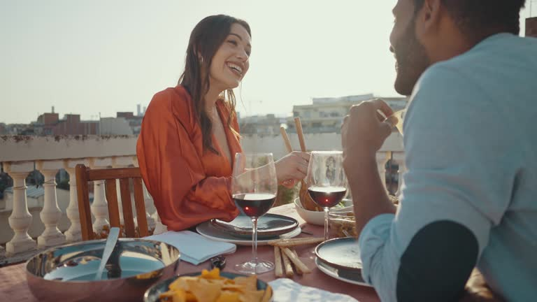 a man and a woman at romantic rooftop restaurant in DC