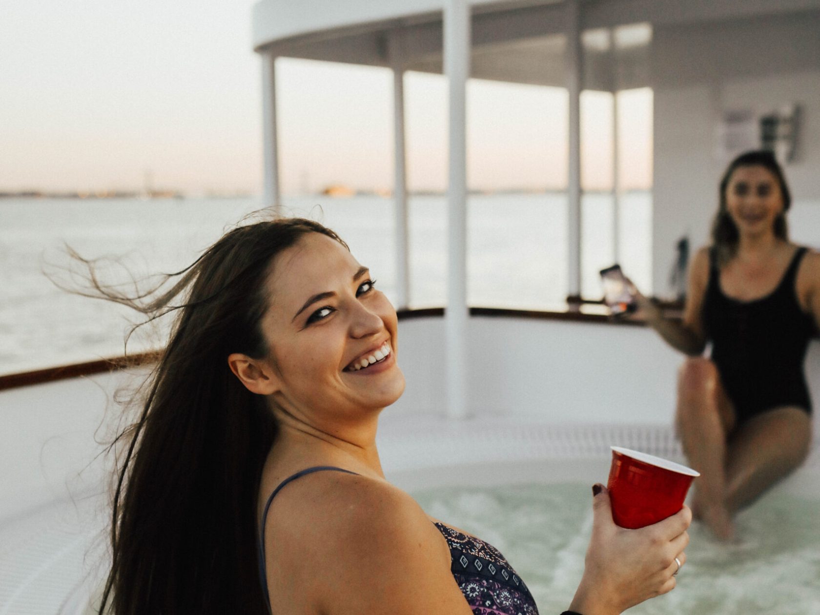 women enjoying the hot tub boat in DC