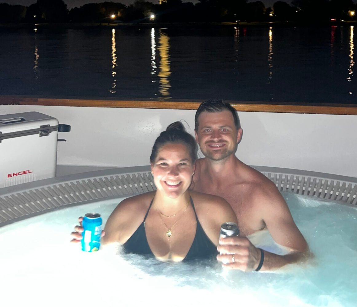 engaged couple in hot tub boat in DC