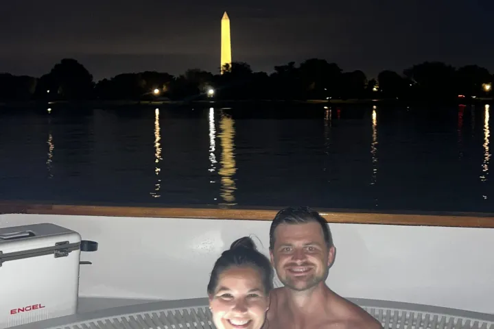 man and woman in a hot tub boat on romantic date night in Washington DC