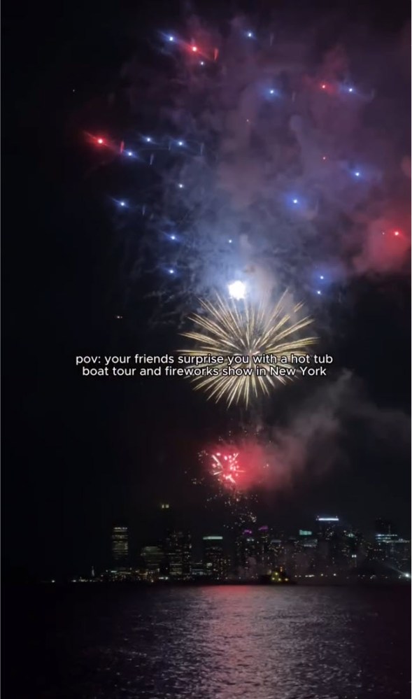 fireworks from DC Hot Tub Boat perspective over New York skyline at night