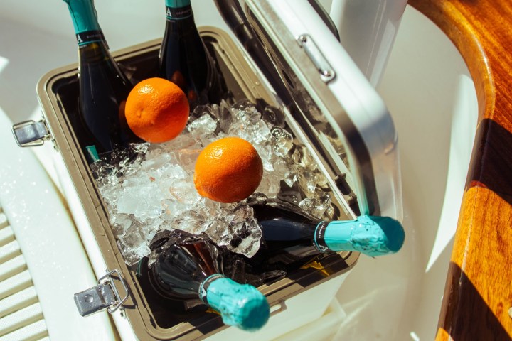 a bowl of oranges on a table